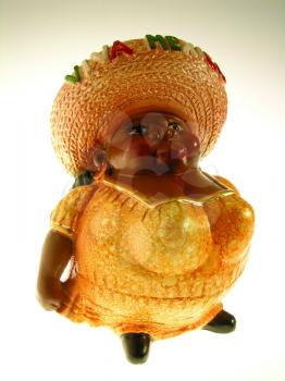 Royalty Free Photo of a Figurine of a Woman in a Straw Hat