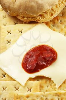bread ,crackers and cheese with tomato sauce