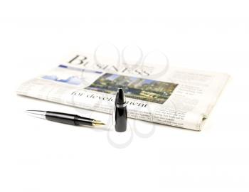 newspaper and pen on white background