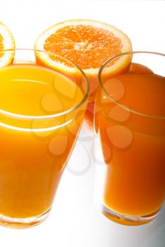 fresh and healthy orange juice ,unfiltered ,over a light table