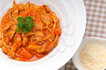 Italian spaghetti pasta with tomato and chicken sauce