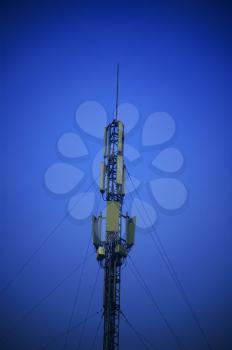 modern telecomunications antenna over a blue sky