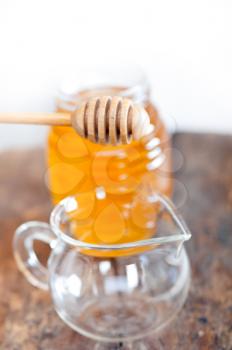 natural honey with a clean dipper not dripping