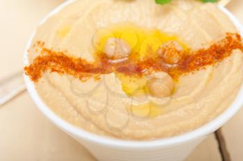 traditional chickpeas Hummus with mint olive oil and paprika on top 