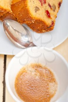 plum cake and espresso coffee over a white rustic table 