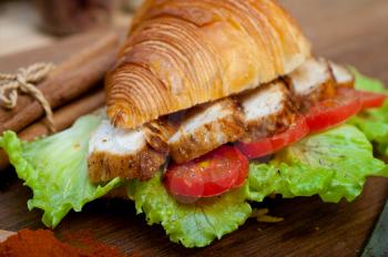 savory croissant brioche bread with chicken breast and vegetable rustic style 