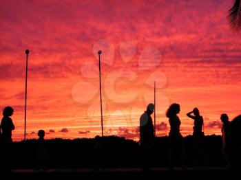 Royalty Free Photo of People Enjoying a Sunset