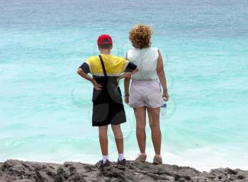 Royalty Free Photo of a Mother and Son Looking at the Ocean