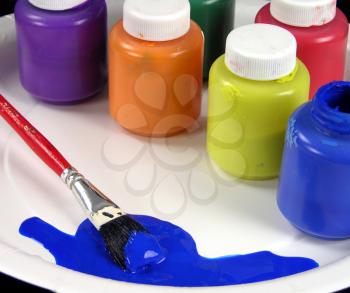 Royalty Free Photo of Paints and a Paintbrush