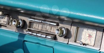 Royalty Free Photo of a Classic Ford Fairlane Radio and Clock