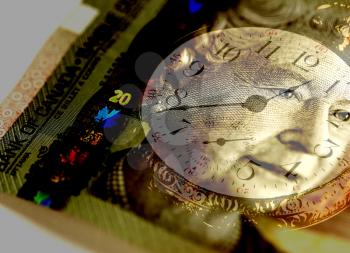 Royalty Free Photo of a Clock and Canadian Currency