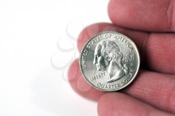 Royalty Free Photo of a Person Holding a Quarter