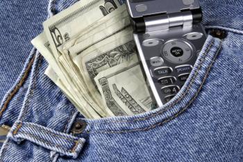 Royalty Free Photo of a Cellphone and Money