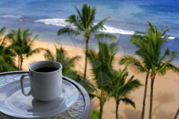 Royalty Free Photo of a Cup of Coffee Overlooking a Tropical Paradise
