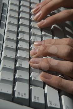 Royalty Free Photo of a Person Typing on a Keyboard