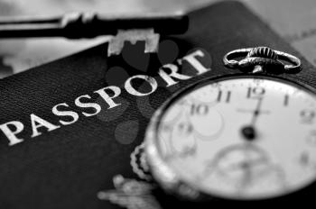 Royalty Free Photo of a Passport and Pocket Watch