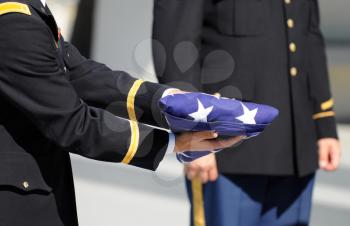 Royalty Free Photo of a Military Honor Guard Soldier Holding a Flag
