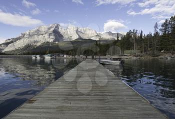 Dock and tour boats at Lake Minnewanka, Banff, Alberta, Canada.