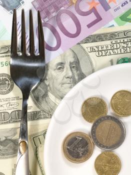Royalty Free Photo of a Money Background With a Plate and Fork