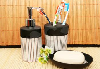 Royalty Free Photo of a Soap Dispenser and Toothbrushes