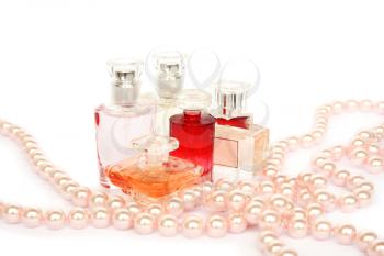 Royalty Free Photo of Perfume Bottles and a Pearl Necklace