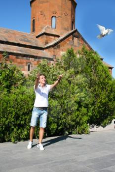 Royalty Free Photo of a Person Releasing a Pigeon