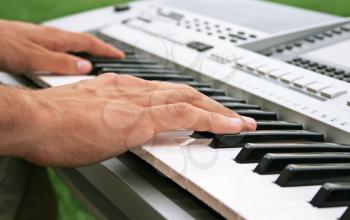 Royalty Free Photo of a Musician Playing the Keyboard