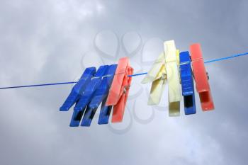 Royalty Free Photo of Clothespins on the Line