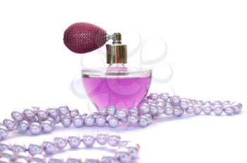 Royalty Free Photo of a Bottle of Perfume and Necklace