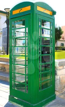 Royalty Free Photo of a Green Telephone Booth