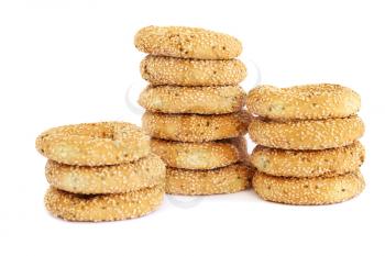Stacks of round rusks isolated on white background.