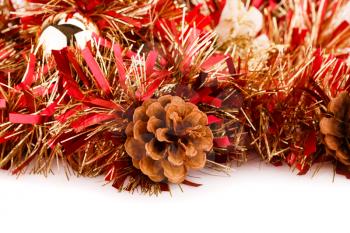 Christmas garland with pine cone on white background.