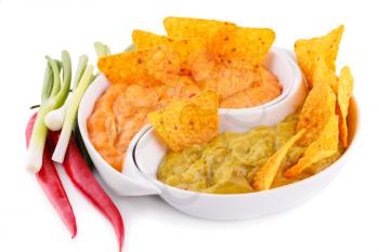 Nachos, guacamole and cheese sauce,  vegetables isolated on white background.