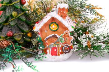 Fir tree candle and toy house on white background.