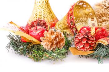 Christmas decoration with bells,cones on white background.