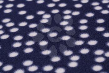 Spotted fabric background closeup picture.