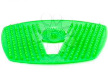Foot green plastic massage pad isolated on white background.
