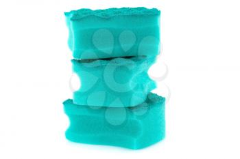 Stack of sponges isolated on white background.