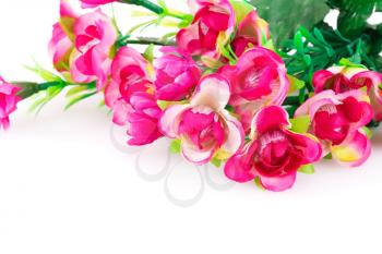 Pink fabric flowers on white background.