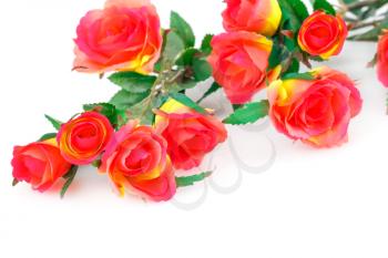 Red fabric roses isolated on white background.