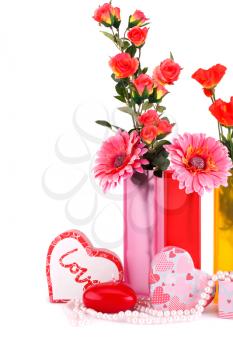 Flowers, red heart candle, necklaces, gift boxes isolated on white background.