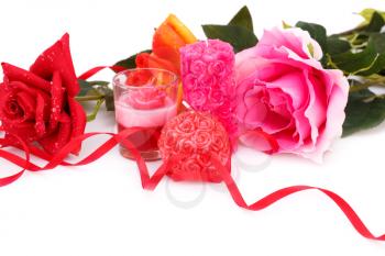 Candles and roses  isolated on white background.