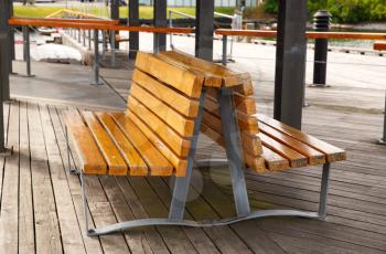 Wooden benches on the pier in Oslo city, Norway.