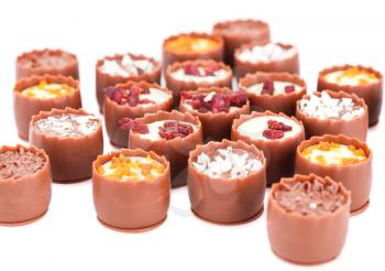 Assortment of chocolate on white background.