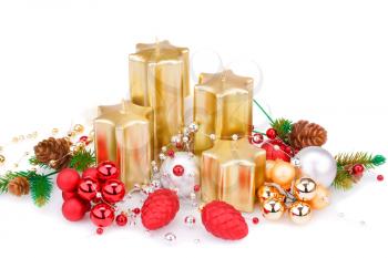 Christmas candles, balls and  fir tree branches  isolated on white background.