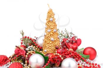 Christmas candle and  decoration with red apples isolated on white background.