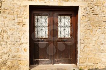 Old wooden brown door with ornament in Lofou village, Cyprus.