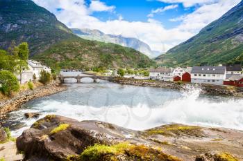 Landscape with mountains, houses, bridge and river in Hellesylt, Norway.