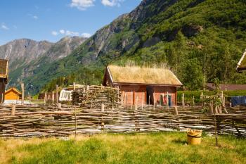 The traditional wooden houses and mountains in the viking village in Norway.