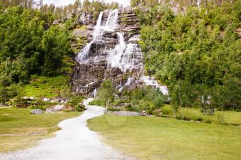 Landscape with Tvindefossen waterfall in Norway.